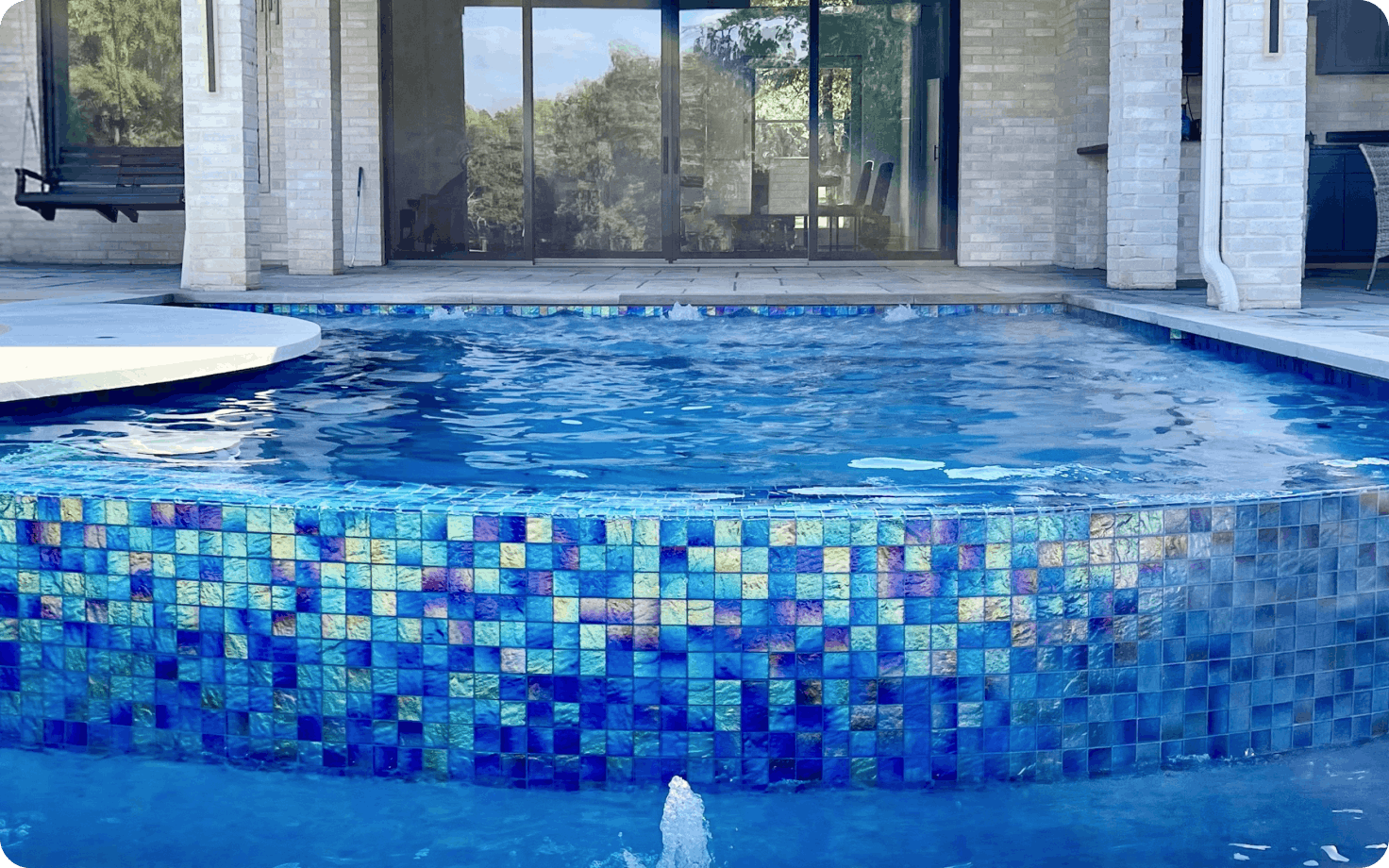 Luxury infinity edge pool overlooking a North Texas landscape